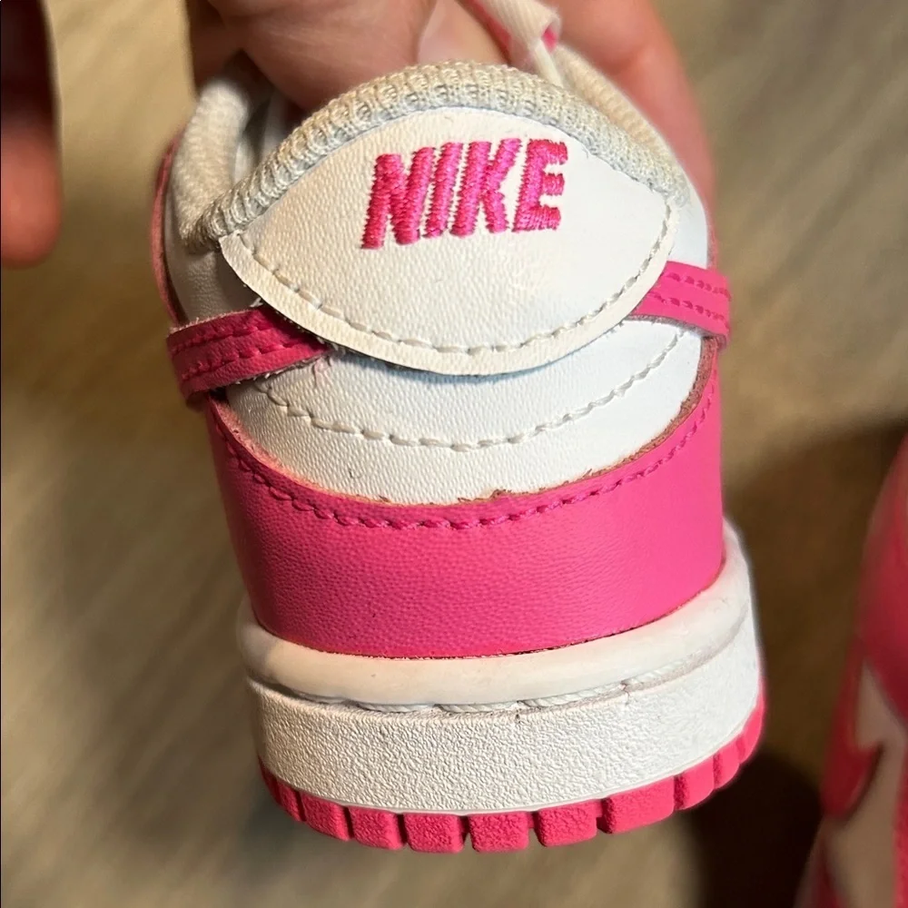 Nike Kids White and Hot Pink Low-Top Sneakers.